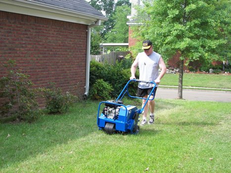 Tim running the rented aerator