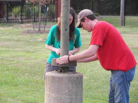 Elizabeth and Chris Geocaching - this thing slides up!