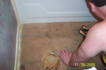 Applying the grout with a trowel