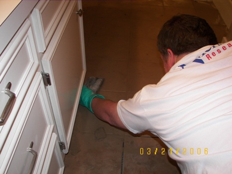 Laying the grout in master bath