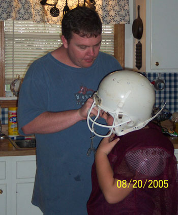Tim helping Zack with his helmet