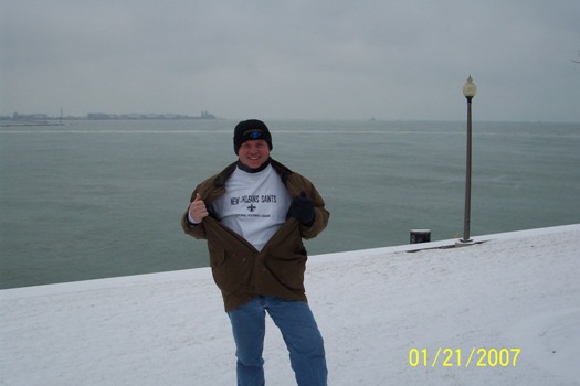 Tim at Lake Michigan, flashing his Saints sweatshirt